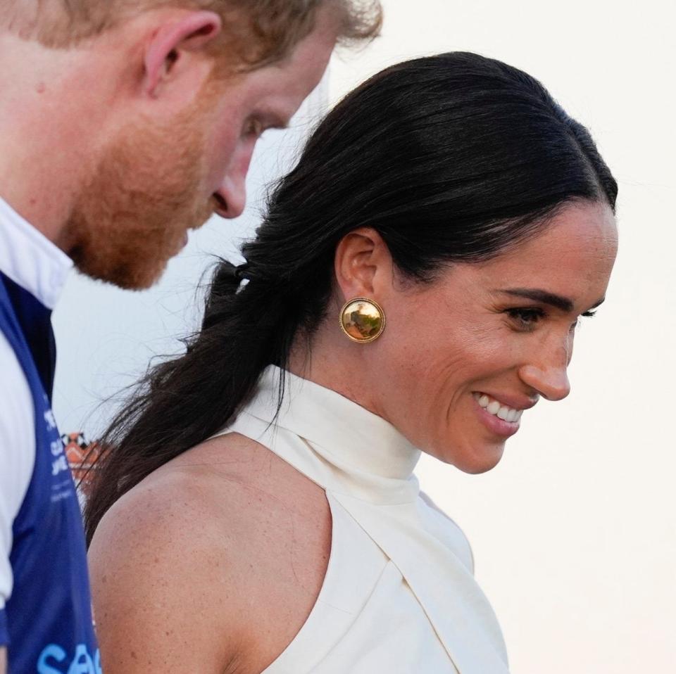 At a polo match in Florida last month, Meghan  wore golden dome Chanel earrings