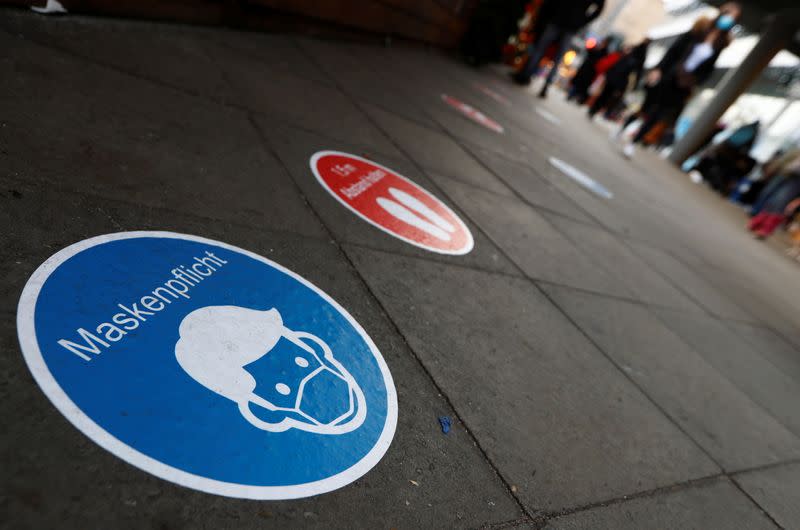 A social distancing floor sign is seen at Schloss Strasse shopping street amid the coronavirus disease (COVID-19) outbreak in Berlin