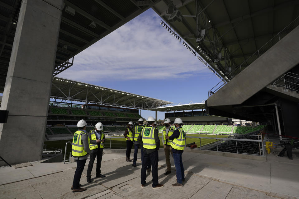 Dignitaries gather for a ribbon cutting at Austin FC's new stadium under construction which has been named Q2 Stadium, Monday, Jan. 25, 2021, in Austin, Texas. (AP Photo/Eric Gay)