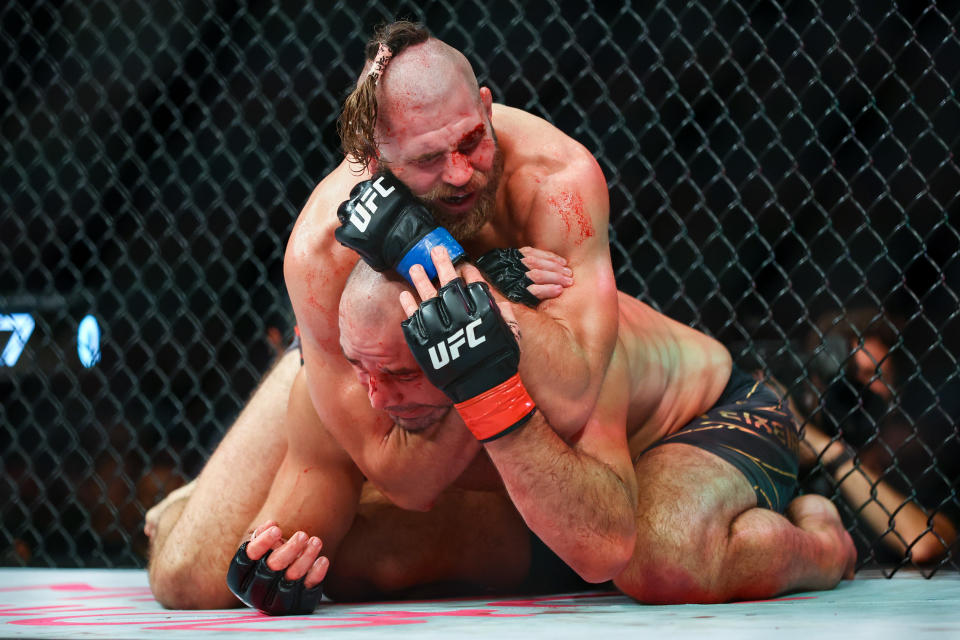 SINGAPORE, SINGAPORE - JUNE 12: Jiri Prochazka of Czech Republic submits Glover Teixeira of Brazil in the UFC light heavyweight championship fight at Singapore Indoor Stadium on June 12, 2022 in Singapore. (Photo by Yong Teck Lim/Getty Images)