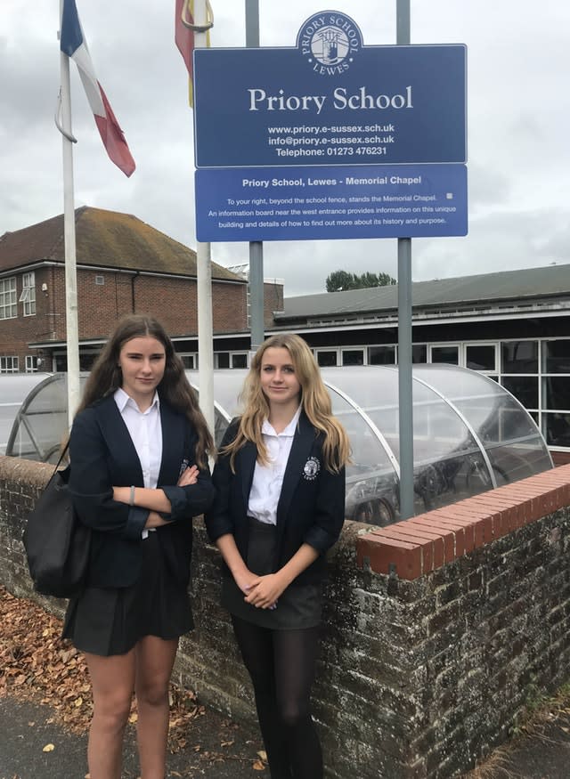 Nina Cullen and Libby Murray protest outside Priory School in Lewes