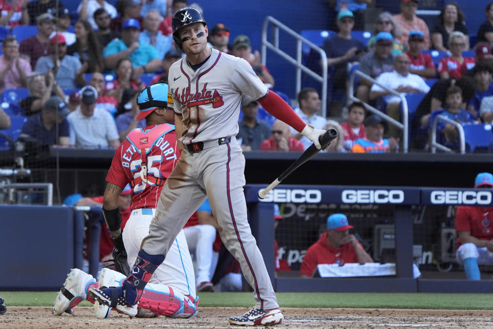 Atlanta Braves' Jarred Kelenic reacts after striking out swinging during the fifth inning of a baseball game against the Miami Marlins, Saturday, April 13, 2024, in Miami. (AP Photo/Wilfredo Lee)