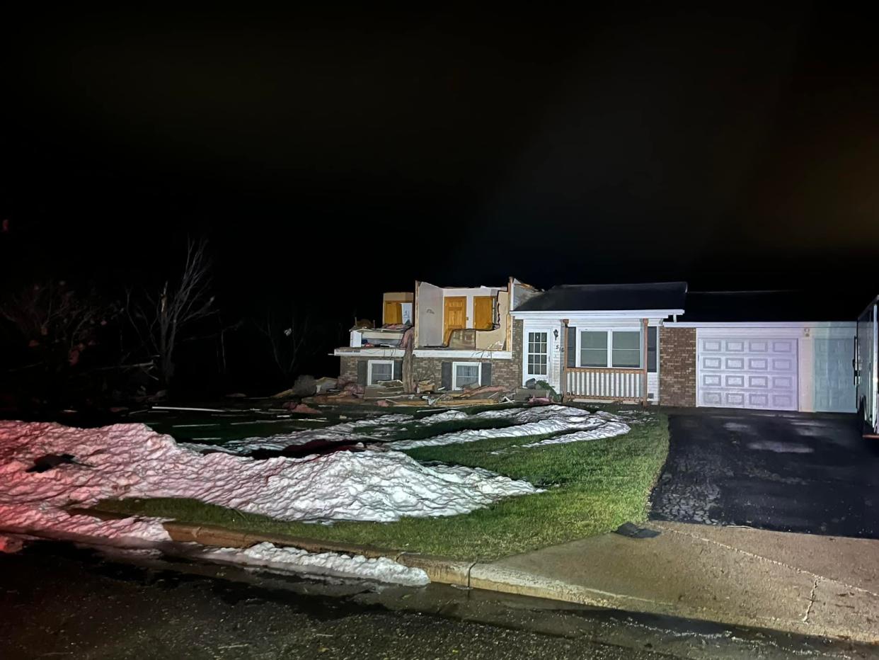 A home's exterior was ripped off from a tornado that tore through Stanley, Wisconsin, Dec. 15.