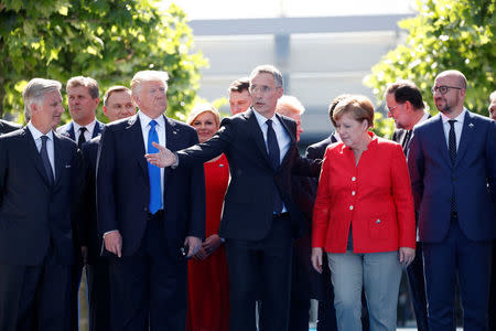 From L-R, Belgium's King Philippe, U.S. President Donald Trump, NATO Secretary General Jens Stoltenberg, German Chancellor Angela Merkel and Belgian's Prime Minister Charles Michel gather with NATO member leaders to pose for a family picture before the start of their summit in Brussels, Belgium, May 25, 2017. REUTERS/Christian Hartmann