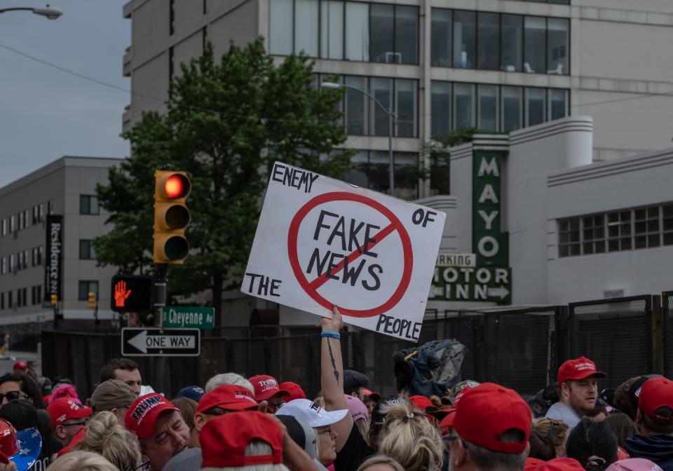 Supporters of US President Donald Trump enter the gates leading to the BOK Center ahead of his campaign rally in Tulsa, Oklahoma June 20,2020. - Hundreds of supporters lined up early for Donald Trump's first political rally in months, saying the risk of contracting COVID-19 in a big, packed arena would not keep them from hearing the president's campaign message. (Photo by SETH HERALD / AFP) (Photo by SETH HERALD/AFP via Getty Images)