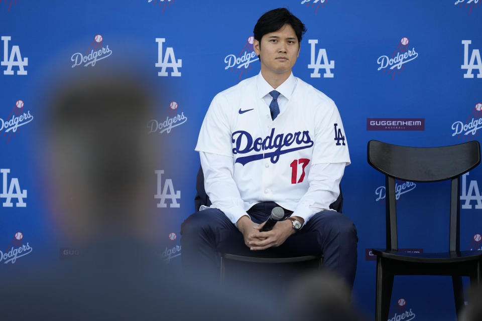 Los Angeles Dodgers' Shohei Ohtani listens to questions during a baseball news conference at Dodger Stadium Thursday, Dec. 14, 2023, in Los Angeles. (AP Photo/Ashley Landis)