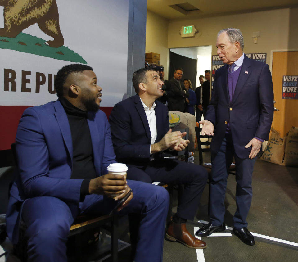 Democratic presidential candidate and former New York City Mayor Michael Bloomberg, right, talks with Stockton, Calif., Mayor Michael Tubbs, left, and San Jose, Calif., Mayor Sam Liccardo, center, during a campaign stop in Sacramento, Calif., Monday, Feb. 3, 2020. . (AP Photo/Rich Pedroncelli)