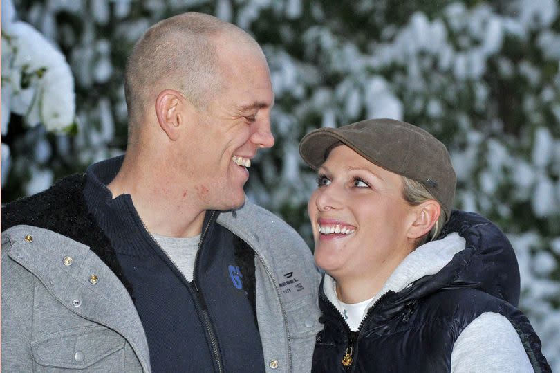 Zara Phillips poses for a photograph with her fiancé Mike Tindall