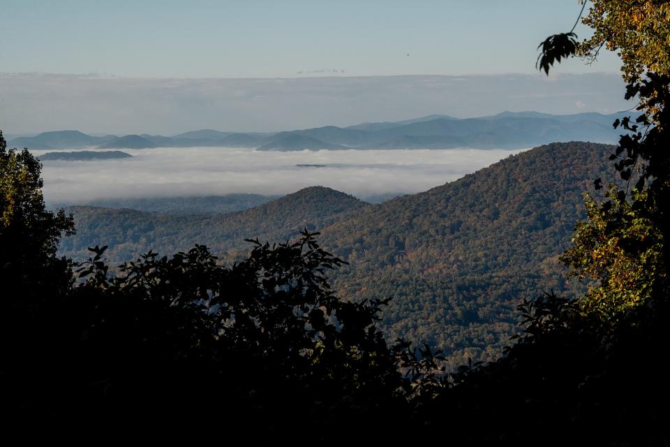 Clouds hang low in the mountains at the Bull Creek Valley viewpoint on the Blue Ridge Parkway, October 19, 2023.