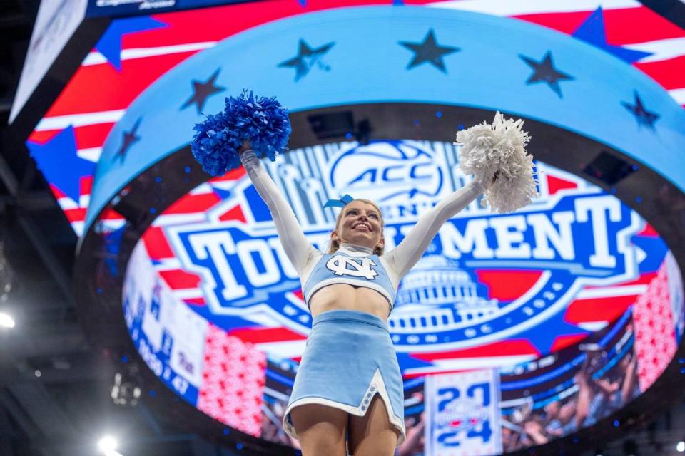 University of North Carolina cheerleader Carly Gregg dies a stunt with the ACC Tournament logo as a backdrop during the Tar Heels’ game against Pittsburgh on Friday, March 15, 2024 in Washington, D.C.