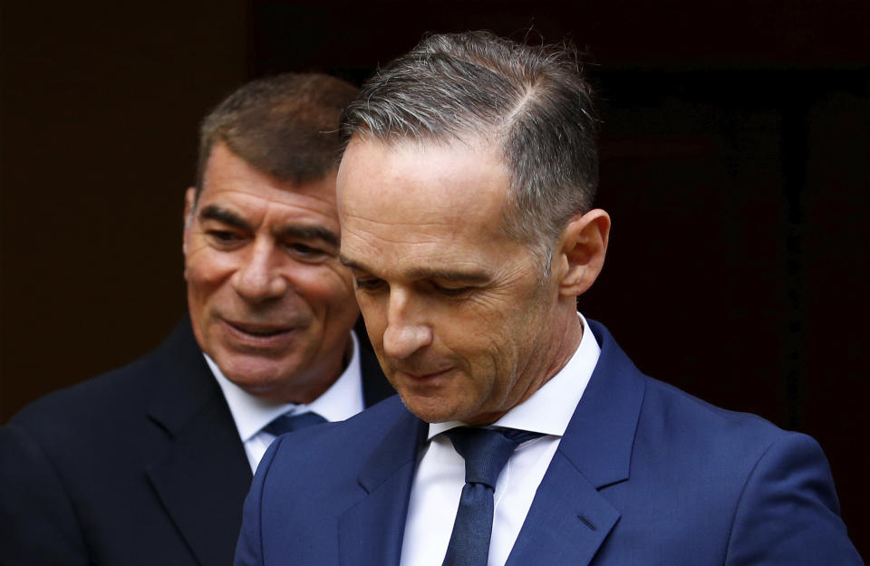 German Foreign Minister Heiko Maas, right, and Israeli Foreign Minister Gabi Ashkenazi arrive to a news conference in front of the Liebermann Villa at the Wannsee lake in Berlin, Germany, August 27, 2020. (Michele Tantussi/Pool Photo via AP)