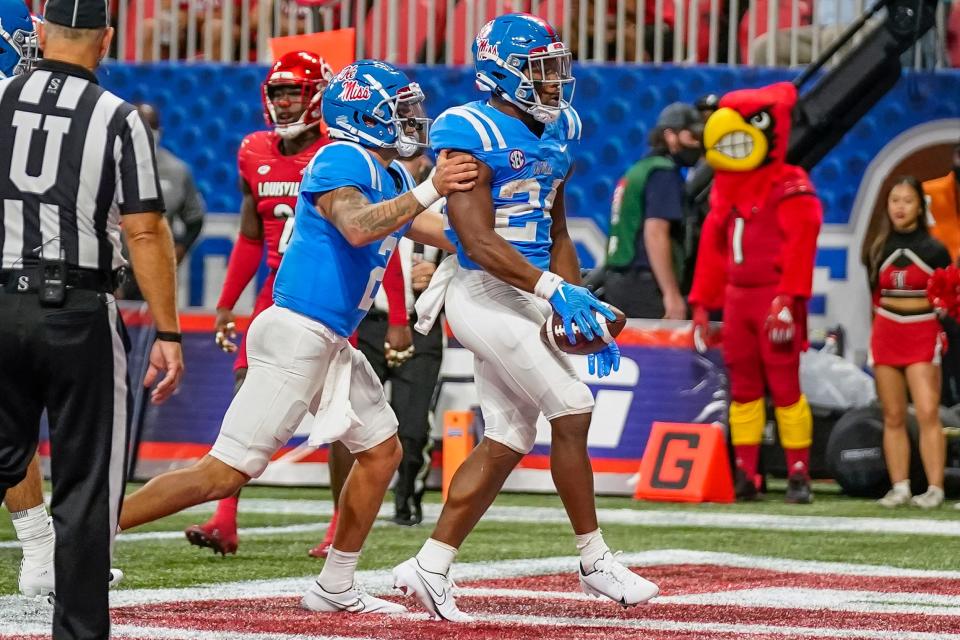 Ole Miss running back Snoop Conner celebrates after scoring a touchdown.