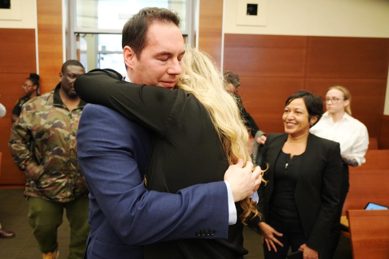 Former Mount Carmel Health doctor William Husel hugs his wife, Mariah Baird, after he was found not guilty in 2022 on 14 counts of murder in connection with fentanyl overdose deaths of former patients under his care. He recently filed a new lawsuit against Mount Carmel's parent company.