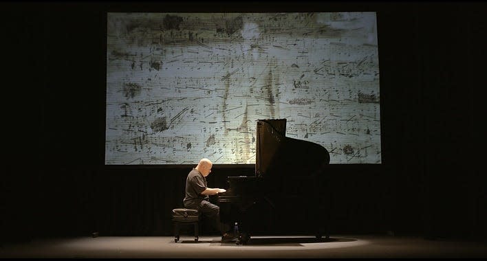 "Dedication," a 66-minute film by Rockland native Roger Peltzman, weaves narrative, projected images and solo piano performances into a poignant, occasionally humorous portrait.