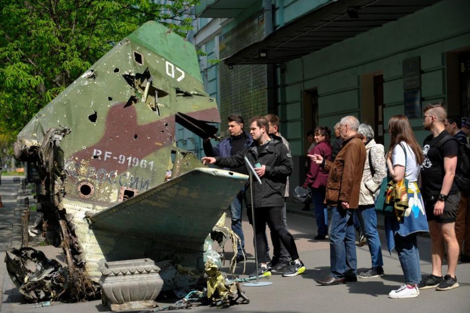 people look at the tail section of a russian su 25sm