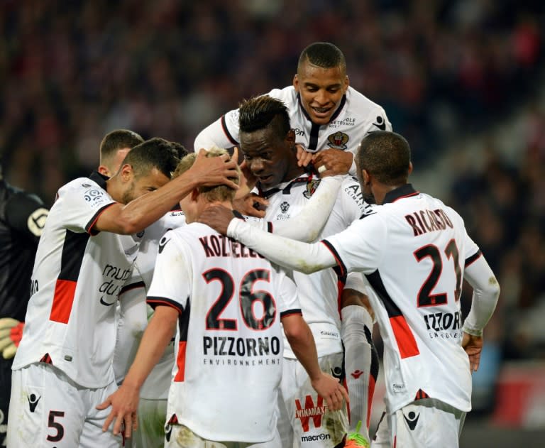 Nice's Mario Balotelli celebrates with teammates after scoring a goal during the French L1 football match against Lille on April 07, 2017