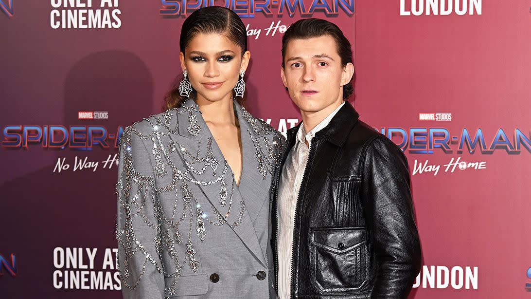 Zendaya and Tom Holland attend a photocall for "Spiderman: No Way Home" at The Old Sessions House on December 05, 2021 in London, England.