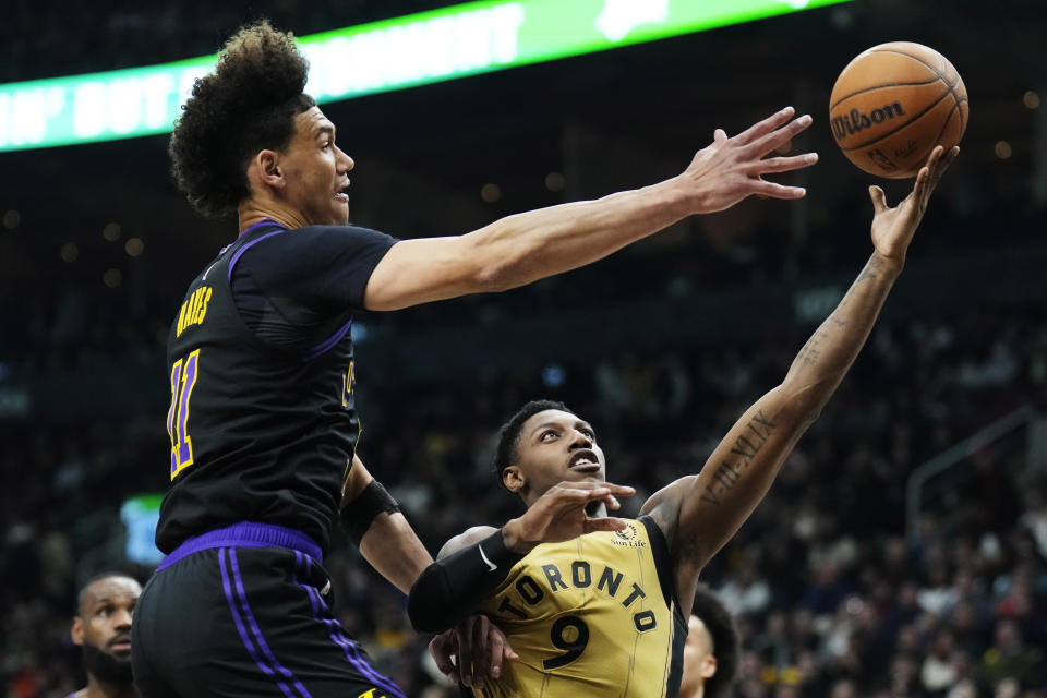 Toronto Raptors guard RJ Barrett (9) shoots as Los Angeles Lakers centre Jaxson Hayes (11) defends during the first half of an NBA basketball game Tuesday, April 2, 2024, in Toronto. (Frank Gunn/The Canadian Press via AP)