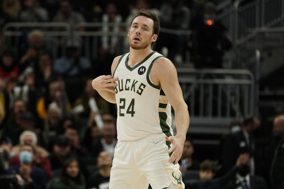 Milwaukee Bucks' Pat Connaughton reactas to his three-point basket during the second half of an NBA basketball game against the Miami Heat Saturday, Dec. 4, 2021, in Milwaukee. (AP Photo/Morry Gash)