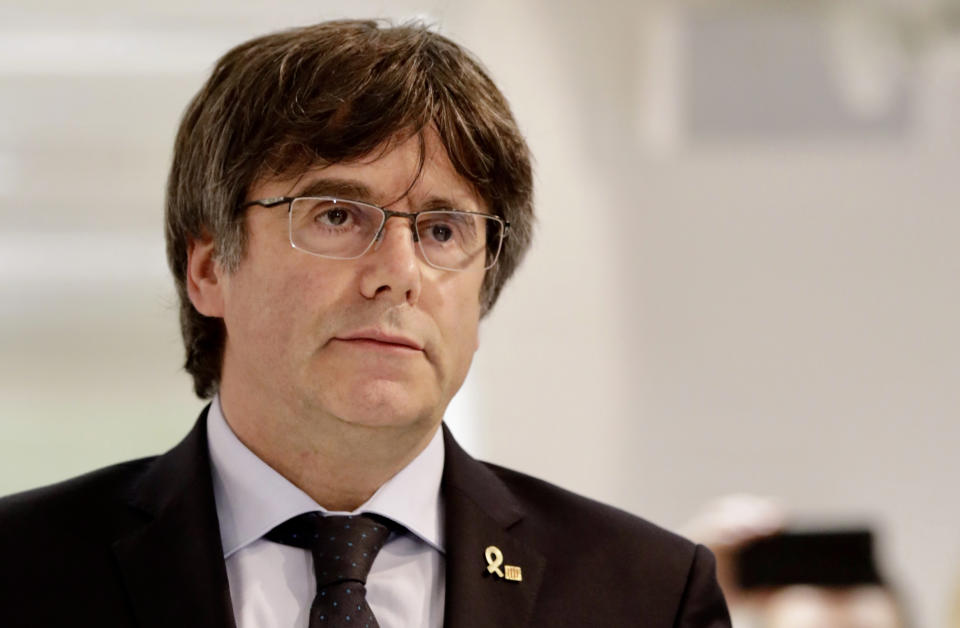FILE - In this Monday, Oct. 14, 2019 file photo, former Catalan leader Carles Puigdemont arrives for a media conference in Brussels. Puigdemont's office said Friday Oct. 18, 2019, fugitive former Catalan leader Carles Puigdemont has handed himself in to Belgian justice authorities after Spain issued a new warrant for his arrest following the sentencing of 12 of his former colleagues. (AP Photo/Olivier Matthys, File)