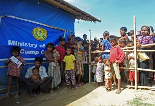 Muslim Rohingya people wait for medical care at a clinic in the Bawdupha Internally Displaced Persons (IDP) camp on the outskirts of Sittwe, the capital of Myanmar's western Rakhine state, on November 2. Aung San Suu Kyi has declined to speak out on behalf of Rohingya Muslims and insisted she will not use "moral leadership" to back either side in deadly communal unrest, according to reports