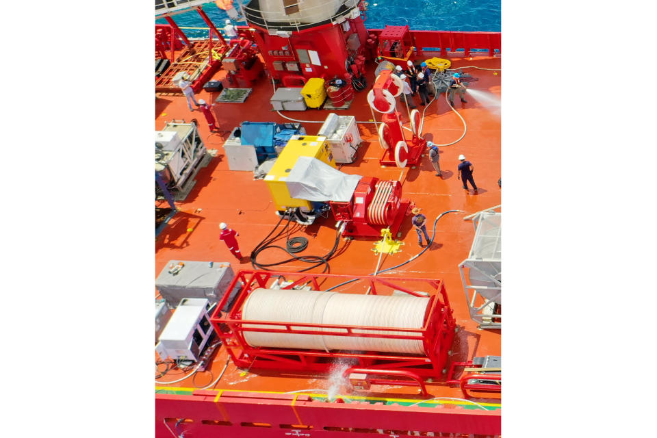 Components of a Flyaway Deep Ocean Salvage System, or FADOSS, rest on the deck of a vessel in this undated photo provided by the U.S. Navy Office of Information. The U.S. Navy said Sunday, June 25, 2023, that it won't be using a Flyaway Deep Ocean Salvage System it had deployed to the effort to retrieve the Titan submersible. The Navy would only use the system if there were pieces large enough to require the specialized equipment. The submersible imploded on its way to tour the Titanic wreckage, killing all five on board. (U.S. Navy Office of Information via AP)