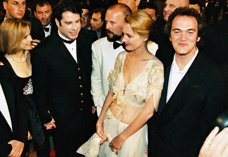 Director Quentin Tarantino, actress Uma Thurman, actor John Travolta and his wife Kelly Preston, actor Bruce Willis pose on the red carpet for the screening of their film "Pulp Fiction" in competition at the 47th Cannes Film Festival in Cannes, France, May 21, 1994. REUTERS/John Schults/File Photo