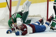 Dallas Stars goaltender Jake Oettinger (29) is hit by Colorado Avalanche right wing Nicolas Aube-Kubel (16) during the second period of an NHL hockey game in Dallas, Friday, Nov. 26, 2021. Oettinger left the game. (AP Photo/LM Otero)