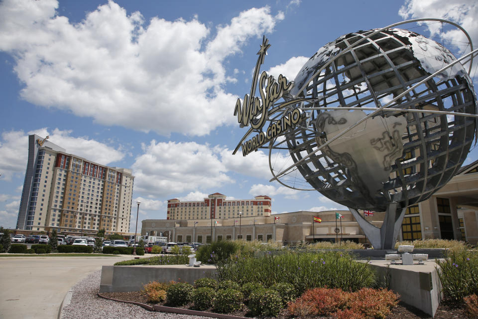 FILE - In this Tuesday, July 23, 2019 file photo, the exterior of the WinStar World Casino and Resort is pictured in Thackerville, Okla. Two of the hotel properties can be seen at left. For the last 15 years, casino gambling has been a financial boon for Oklahoma and many of the Native American tribes located there. (AP Photo/Sue Ogrocki, File)