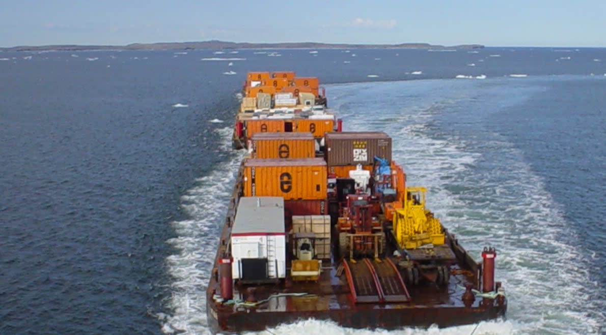 An N.W.T. Marine Transportation System barge in a file photo from 2016. Cargo destined to northern communities may have to take a significant detour due to low water on the Mackenzie River. (NTCL - image credit)