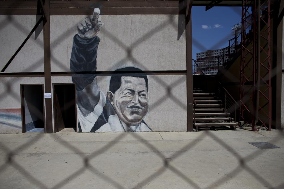 A mural of Venezuela's late President Hugo Chavez decorates a wall in the "23 de Enero" neighborhood of Caracas, Venezuela, Sunday, July 28, 2019, on his birthday anniversary. Venezuelans are paying homage to Chávez on the day of his birth, which happens to coincide with the birthday of one of the nation’s leading opposition figures, Juan Guaidó. (AP Photo/Ariana Cubillos)