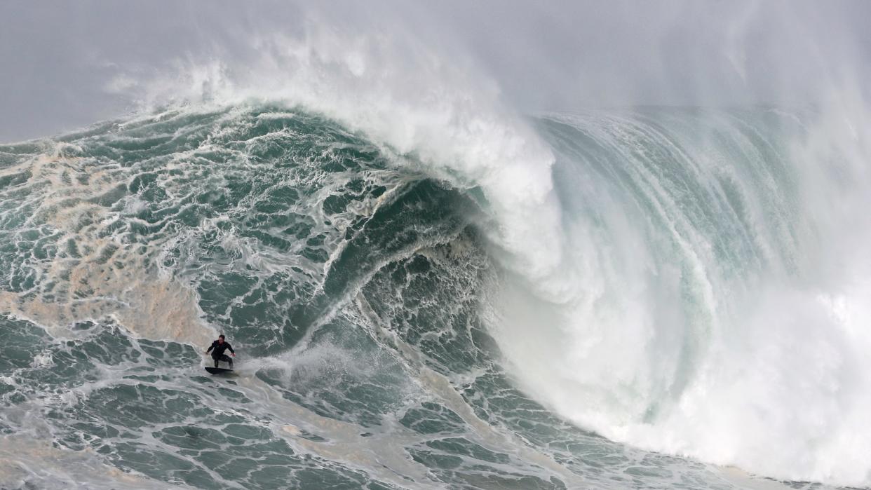 Sebastian Steudtner from Germany rides a wave during a tow surfing session at Praia do Norte or North Beach in Nazare, Portugal, Saturday, Feb. 15, 2020.