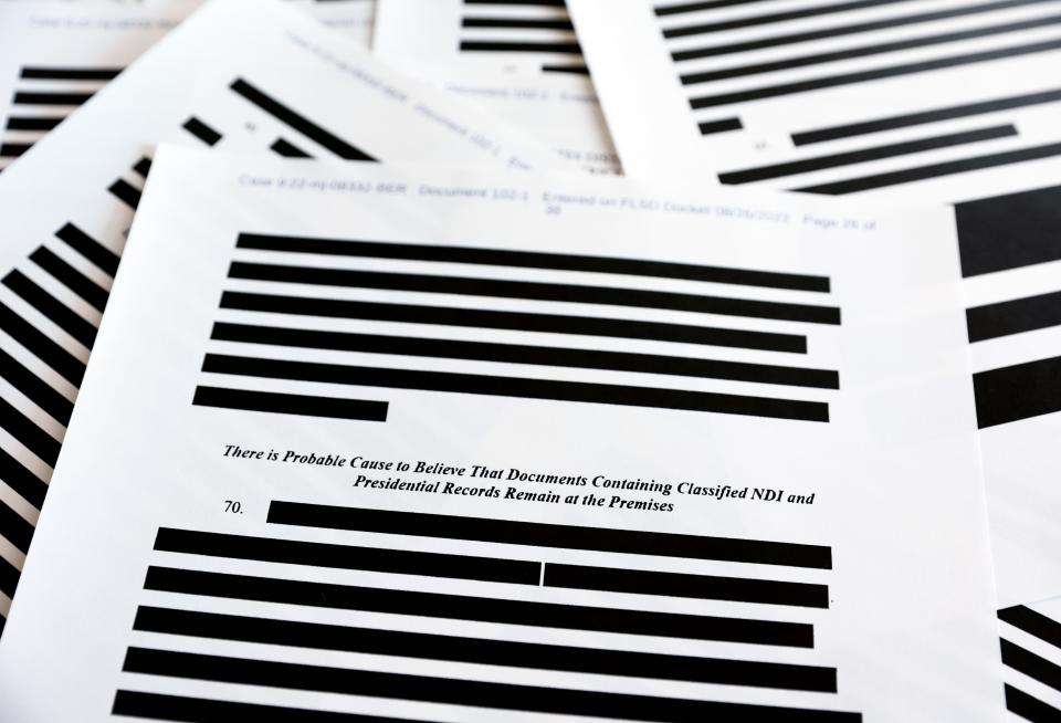 Pages from the government’s released version of the F.B.I. search warrant affidavit for former President Donald Trump's Mar-a-Lago estate on August 27, 2022 in California. The 32-page affidavit was heavily redacted for the protection of witnesses and law enforcement and to ensure the ‘integrity of the ongoing investigation.