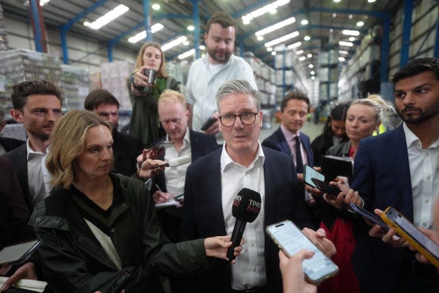 Sir Keir Starmer is surrounded by journalists