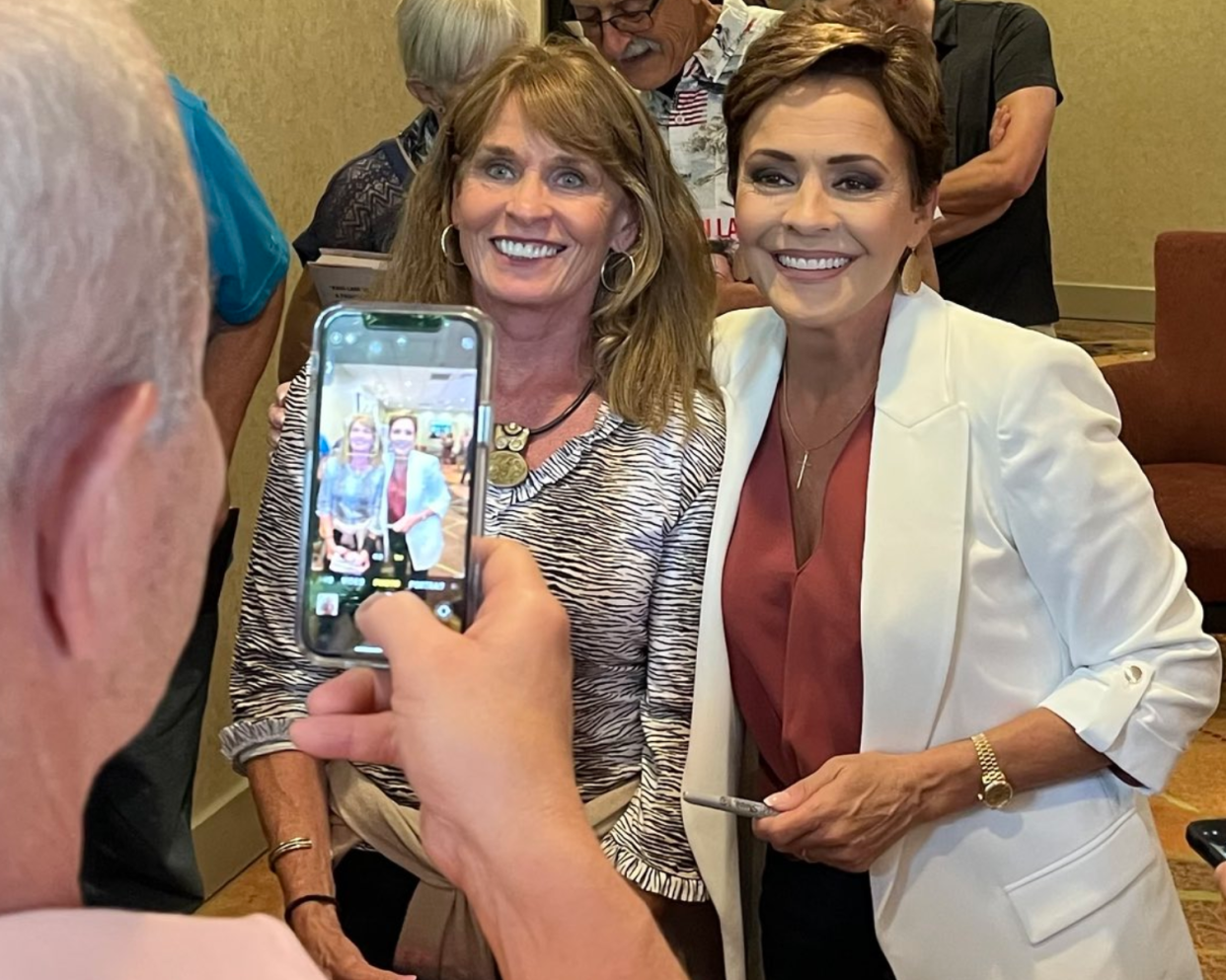 Kari Lake, right, poses with a supporter at Wauwatosa's Radisson Hotel on Friday, June 30, 2023.