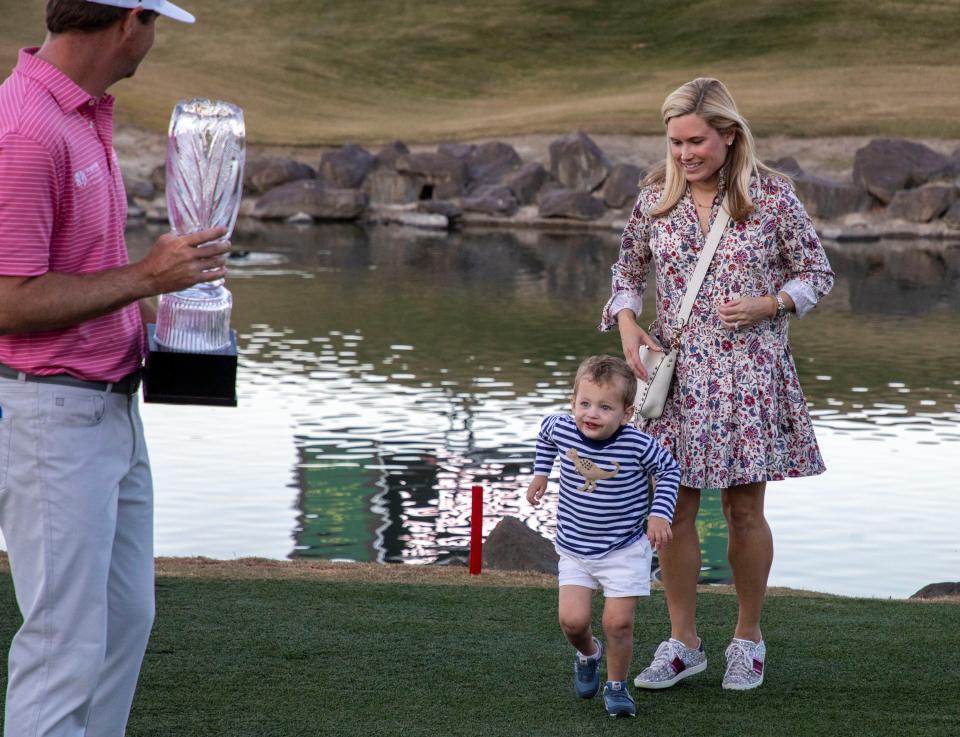 3-year-old James Swafford runs over to his dad, Hudson Swafford, to celebrate with him after winning The American Express at PGA West in La Quinta, Calif., Sunday, Jan. 23, 2022. 