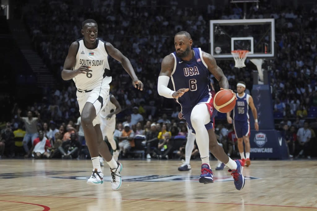 United States’ forward LeBron James runs as he advances to score as South Sudan’s center Khaman Maluach attempts to defend during an exhibition basketball game between the United States and South Sudan, at the o2 Arena in London, Saturday, July 20, 2024. (AP Photo/Kin Cheung)<span class="credit"> – </span>