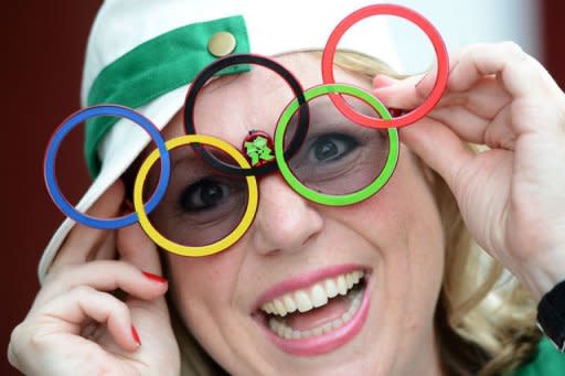 A spectator wearing glasses with Olympic rings arrives at the Olympic Park prior the opening ceremony of the London 2012 Olympic Games