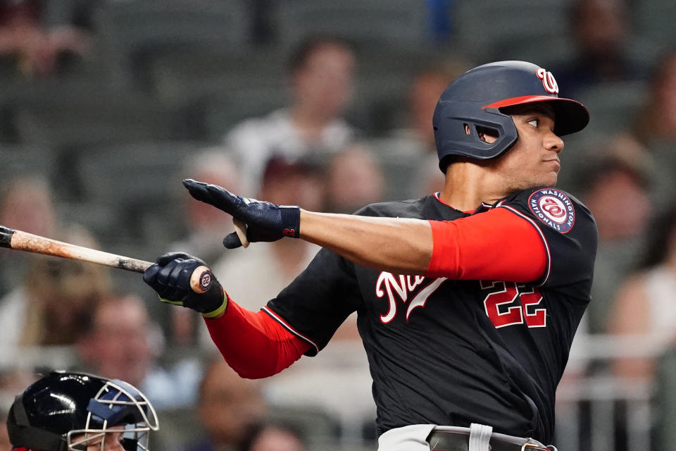 Washington Nationals' Juan Soto (22) drives in two runs with a base hit in the fourth inning of a baseball game against the Atlanta Braves Tuesday, June 1, 2021, in Atlanta. (AP Photo/John Bazemore)