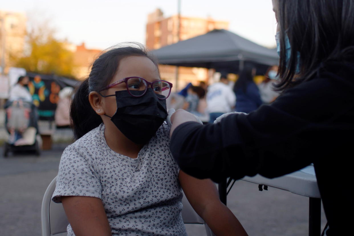 Eight year-old Sofia Palacios gets her coronavirus disease (COVID-19) vaccine at a clinic at La Colaborativa, in Chelsea, Massachusetts, U.S., November 9, 2021.    REUTERS/Brian Snyder