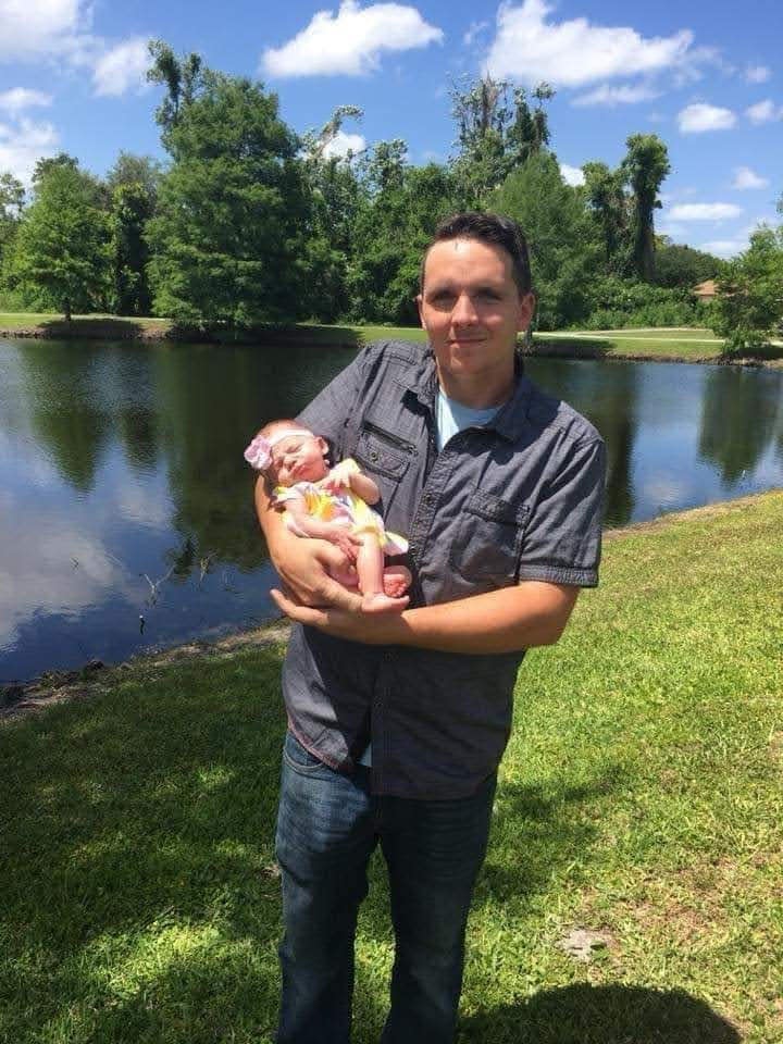 Justin Roberson holding his daughter Amberlee Roberson