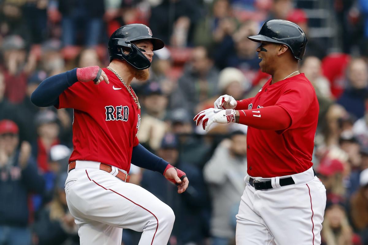 Rafael Devers stares down Cal Quantrill on his way back to the