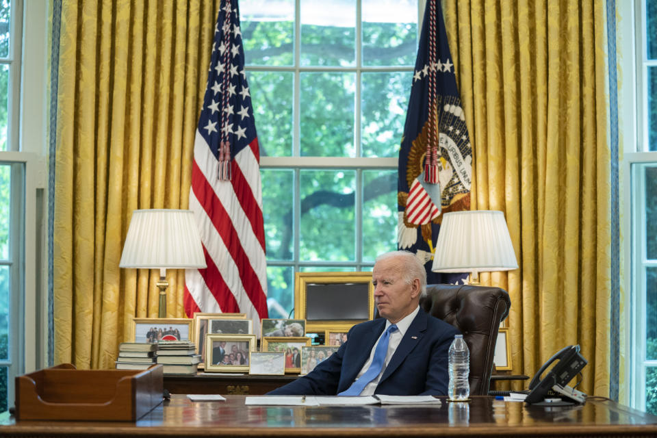 FILE - President Joe Biden listens to a question during an interview with the Associated Press in the Oval Office of the White House, June 16, 2022, in Washington. Biden’s top political advisers are bracing for big midterm losses in November. They know that the party holding the White House nearly always losses congressional seats in the first midterm election of a new presidency. (AP Photo/Evan Vucci, File)