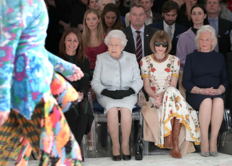 <div class="inline-image__caption"><p>Britain's Queen Elizabeth II sits next to Vogue Editor-in-Chief Anna Wintour and Caroline Rush, Chief Executive of the British Fashion Council, and royal dressmaker Angela Kelly as they view Richard Quinn's runway show before presenting him with the inaugural Queen Elizabeth II Award for British Design as she visits London Fashion Week, in London, Britain February 20, 2018.</p></div> <div class="inline-image__credit">REUTERS/Yui Mok/Pool</div>