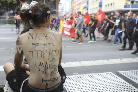 Consumer rights activists take part in a march to protest against the Transatlantic Trade and Investment Partnership (TTIP) and Comprehensive Economic and Trade Agreement (CETA) in Frankfurt, Germany, September 17, 2016. REUTERS/Kai Pfaffenbach