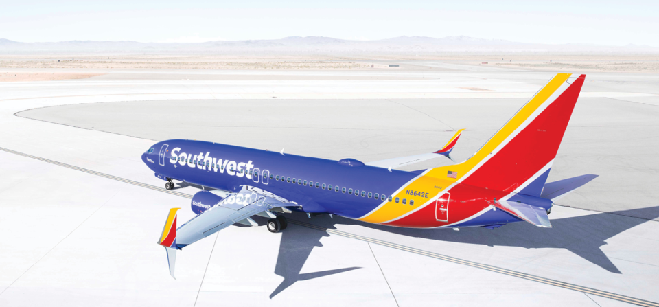 Southwest-labeled aircraft on taxiway in a desert landscape.