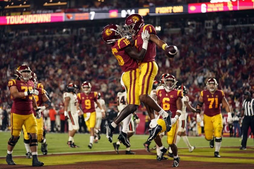 Southern California wide receiver Gary Bryant Jr. (1) celebrates his touchdown catch with wide receiver Tahj Washington.