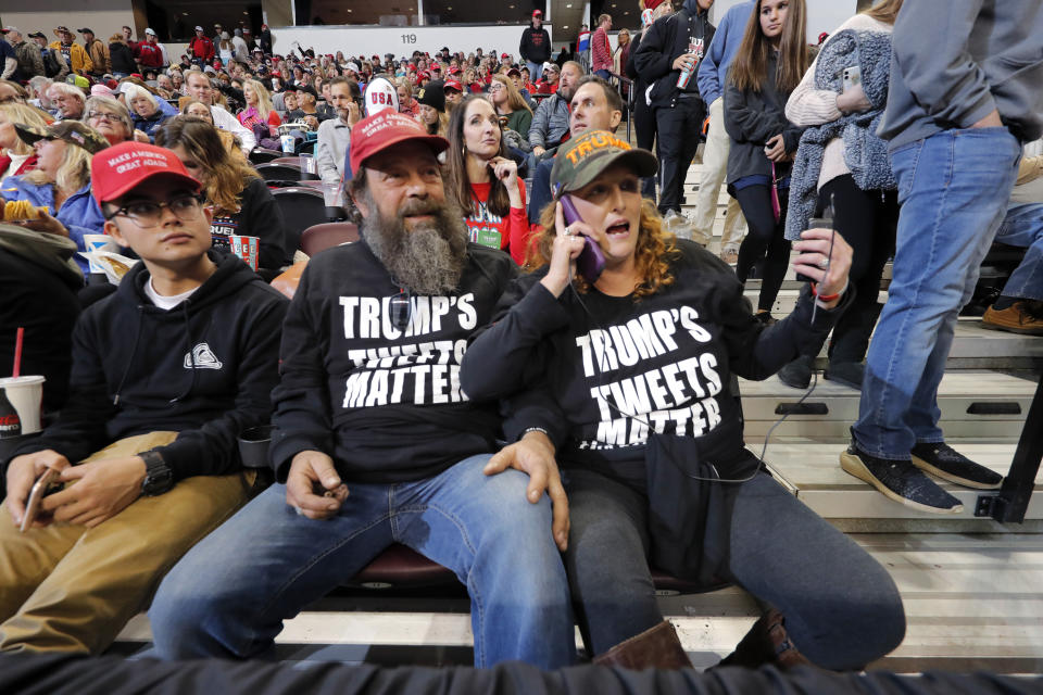 Pastor Sean Jones, center, of the New Beginnings Baptist Church in Walla Walla, Wash., waits for President Donald Trump to arrive at a campaign rally in Bossier City, La., Thursday, Nov. 14, 2019. (AP Photo/Gerald Herbert)