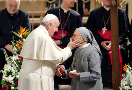 Pope Francis greets a nun at Saint Peter's Cathedral in Rabat, Morocco, March 31, 2019. REUTERS/Remo Casilli