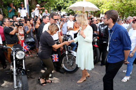 Britain's Camilla, Duchess of Cornwall is greeted by locals at a British Classic Car event in Havana, Cuba March 26, 2019. Chris Jackson/Pool via REUTERS